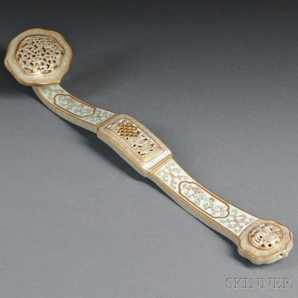 Porcelain Scepter, China, 20th century, overall gil: Porcelain Scepter, China, 20th century, overall gilt decoration of clouds and scrolling tendrils on a turquoise glaze, six-character Qianlong mark below center reserve, lg. 19 1/2 in.