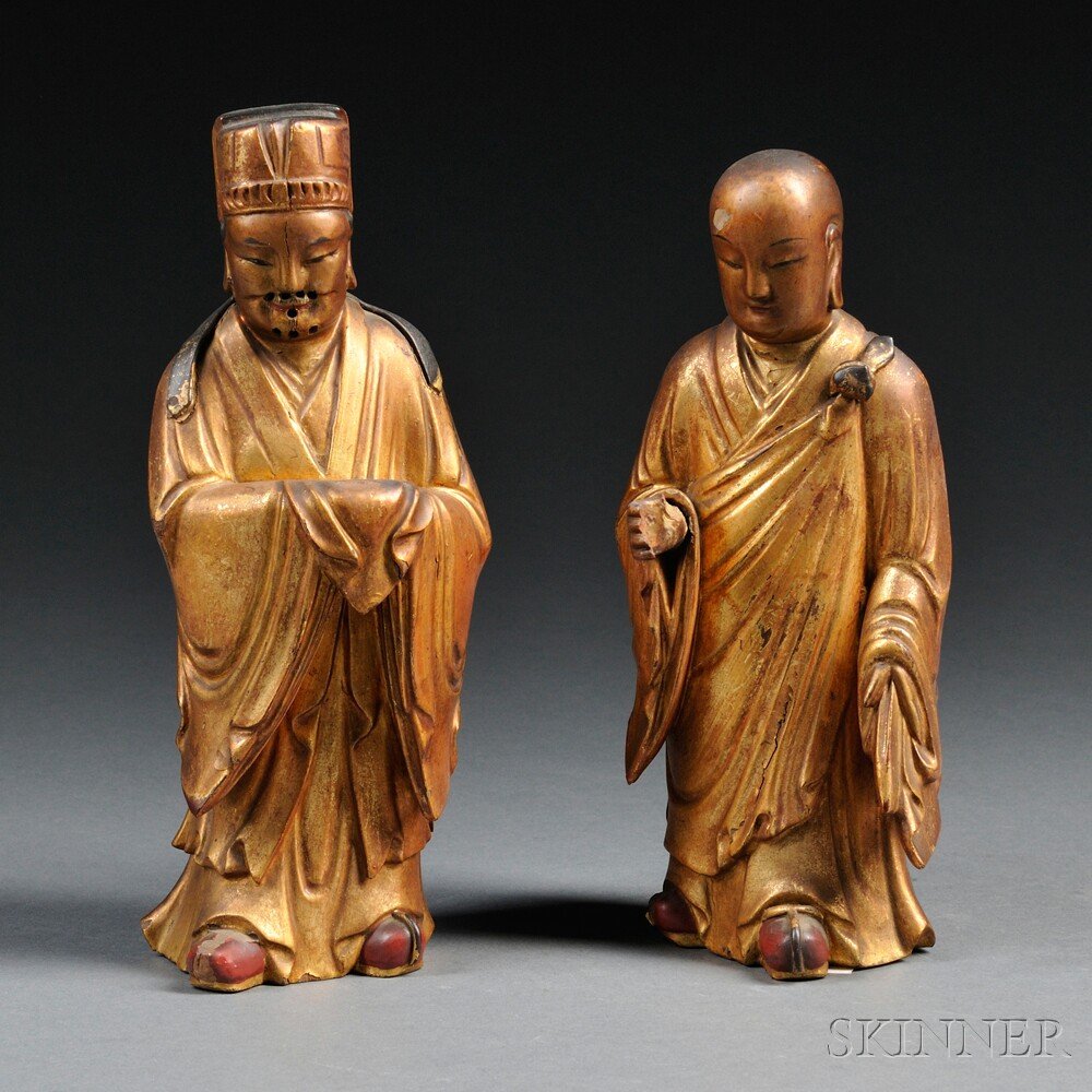Pair of Wood Figures, China, 19th century, carved: Pair of Wood Figures, China, 19th century, carved wooden Buddhist deity and monk, possibly holding a staff and a ritual vessel, gilt and colored with black and red, hole in the base, back hollowed as 