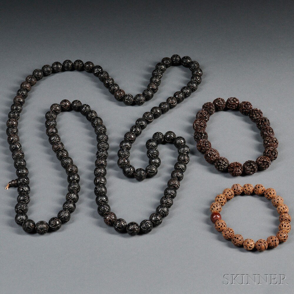 Wooden Bead Necklace and Bracelets, China, 20th ce: Wooden Bead Necklace and Bracelets, China, 20th century, the beads carved with auspicious symbols, characters, and figures, lg. to 32 in.