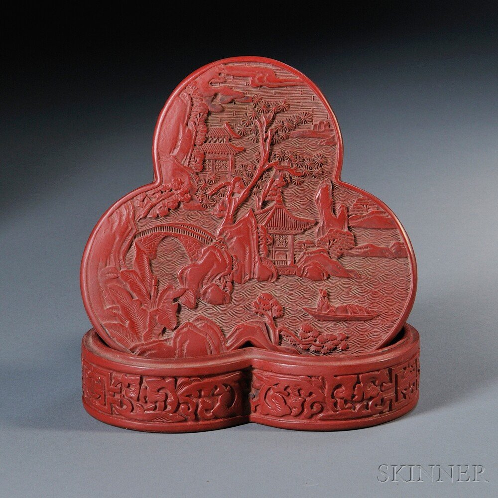 Cinnabar Lacquer Box, China, 19th/20th century, lo: Cinnabar Lacquer Box, China, 19th/20th century, lobed shape, the cover depicting pagodas in a mountain landscape, lg. 5 3/4 in.