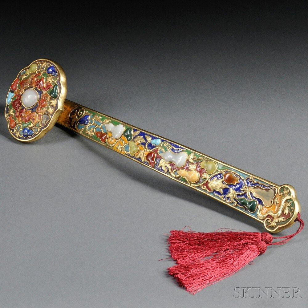 Gilt-metal Ruyi Scepter, China, 19th century, elab: Gilt-metal Ruyi Scepter, China, 19th century, elaborately decorated with enamels and inlays of lapis, carnelian, and other hardstones, depicting a plant bearing double-gourds, the cloud-shaped head em