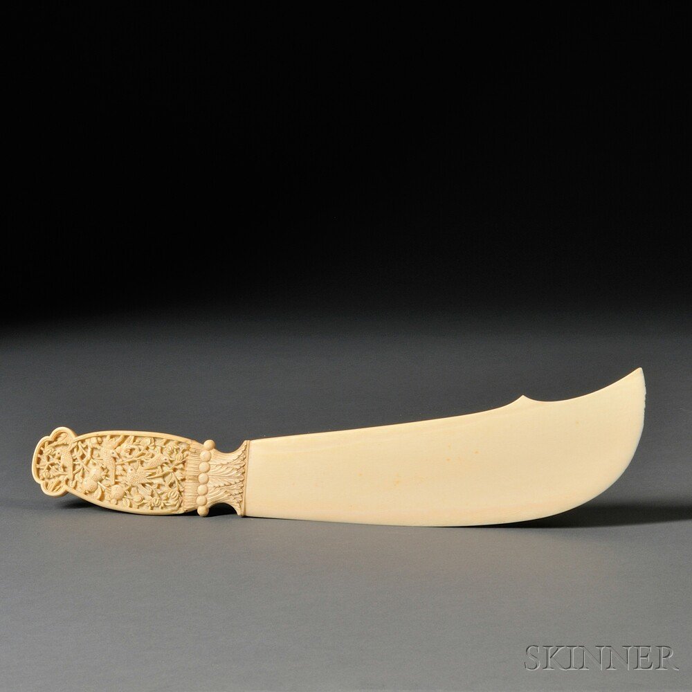 Ivory Carving in the Form of a Scimitar, Asia, 19t: Ivory Carving in the Form of a Scimitar, Asia, 19th/20th century, possibly a letter opener, with decorative handle with carved birds in midst of branches with fruit and flowers in low relief, lg. 15 i
