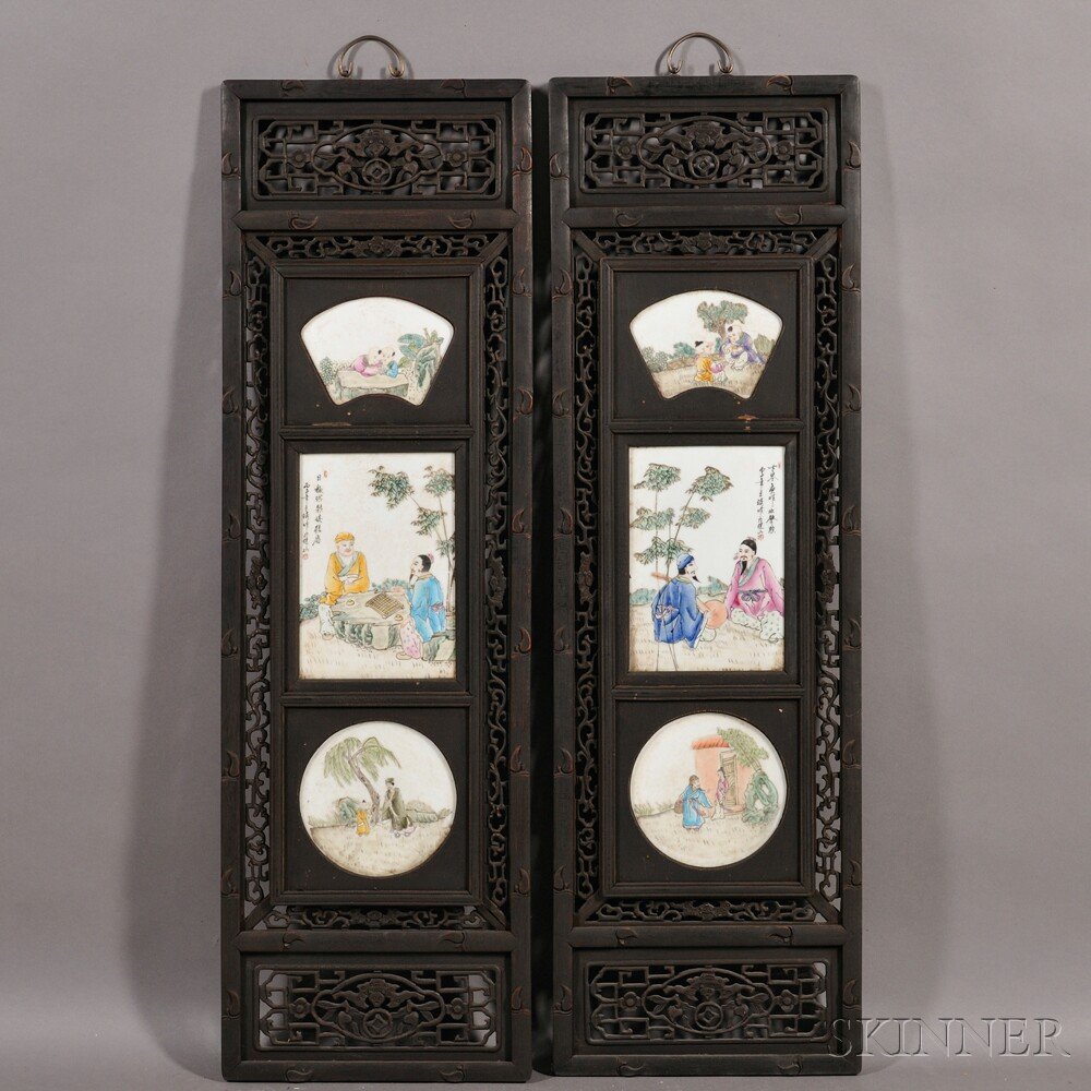 Set of Four Carved Wood Panels, China, 20th centur: Set of Four Carved Wood Panels, China, 20th century, with pierced decorations of bats, ruyi, and scrolling foliage, each inset with three porcelain plaques painted with figures at leisure in garden se