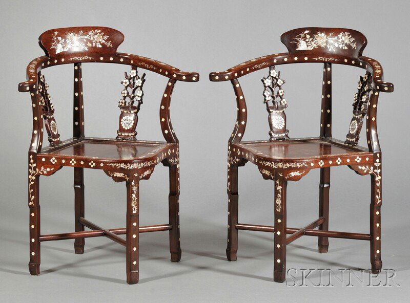 Pair of Inlaid Corner Chairs, China, 20th century,: Pair of Inlaid Corner Chairs, China, 20th century, curved back with two pierced splats of blossom design, supported on four shaped legs joined by cross-stretchers, overall decorated with mother-of-pea