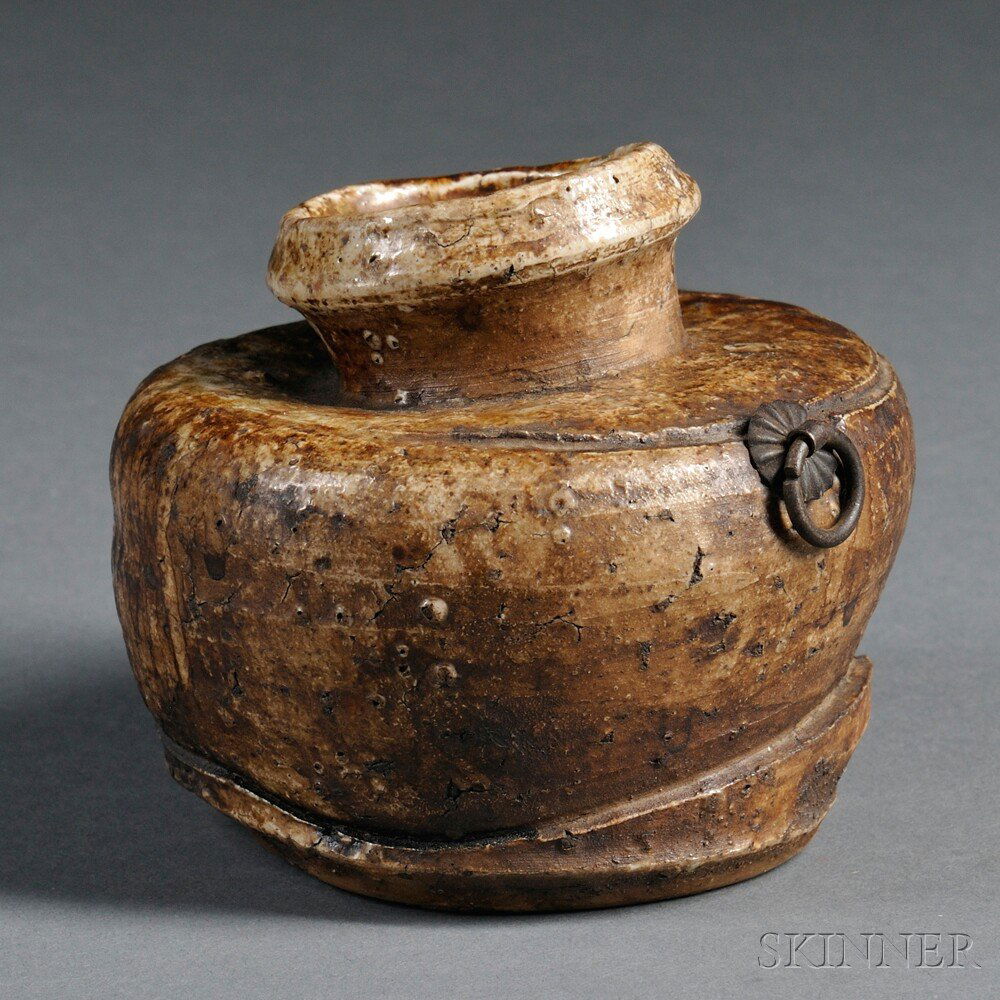 Hanging Pottery Flower Vase, Japan, 20th century,: Hanging Pottery Flower Vase, Japan, 20th century, earthenware in a deformed round shape, with flat shoulder, waisted neck, and raised bottom, a metal decorative piece with loose ring on the shoulder,