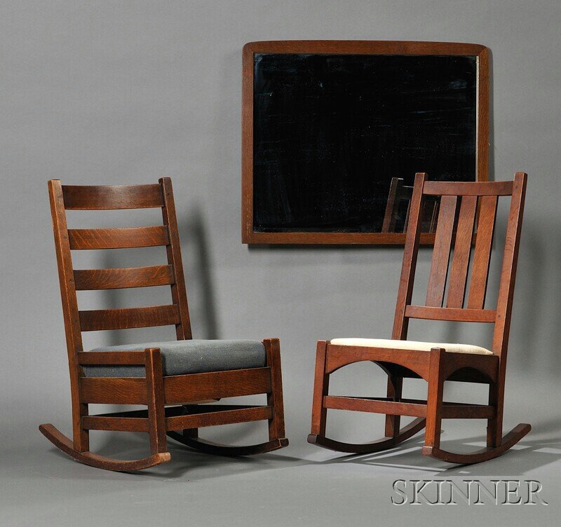 Two Arts & Crafts Oak Rocking Chairs and a Mirror, c. 1: Two Arts & Crafts Oak Rocking Chairs and a Mirror, c. 1912, the first chair with four curved horizontal back slats over double seat rails and front, back and side stretchers, with a spring cushion uph