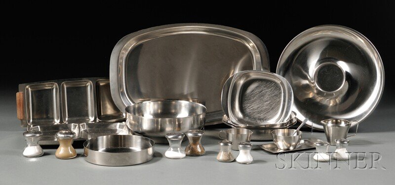Twenty-two Pieces of Scandinavian Stainless Steel and G: Twenty-two Pieces of Scandinavian Stainless Steel and Glass Tableware, four small glass salt shakers, three large glass salt shakers, and one large glass pepper grinder, all with stainless lids; shape