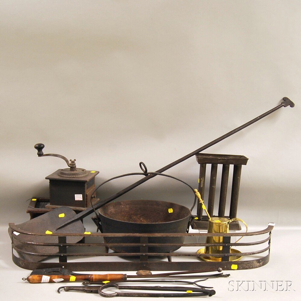 Thirteen Assorted Metal Fireplace, Hearth, and Domestic: Thirteen Assorted Metal Fireplace, Hearth, and Domestic Items, a brass Cape Cod lighter with tray, a wrought iron peel, shovel, fork, tongs, poker, and fender, a cast iron footed hanging pot, a hearth