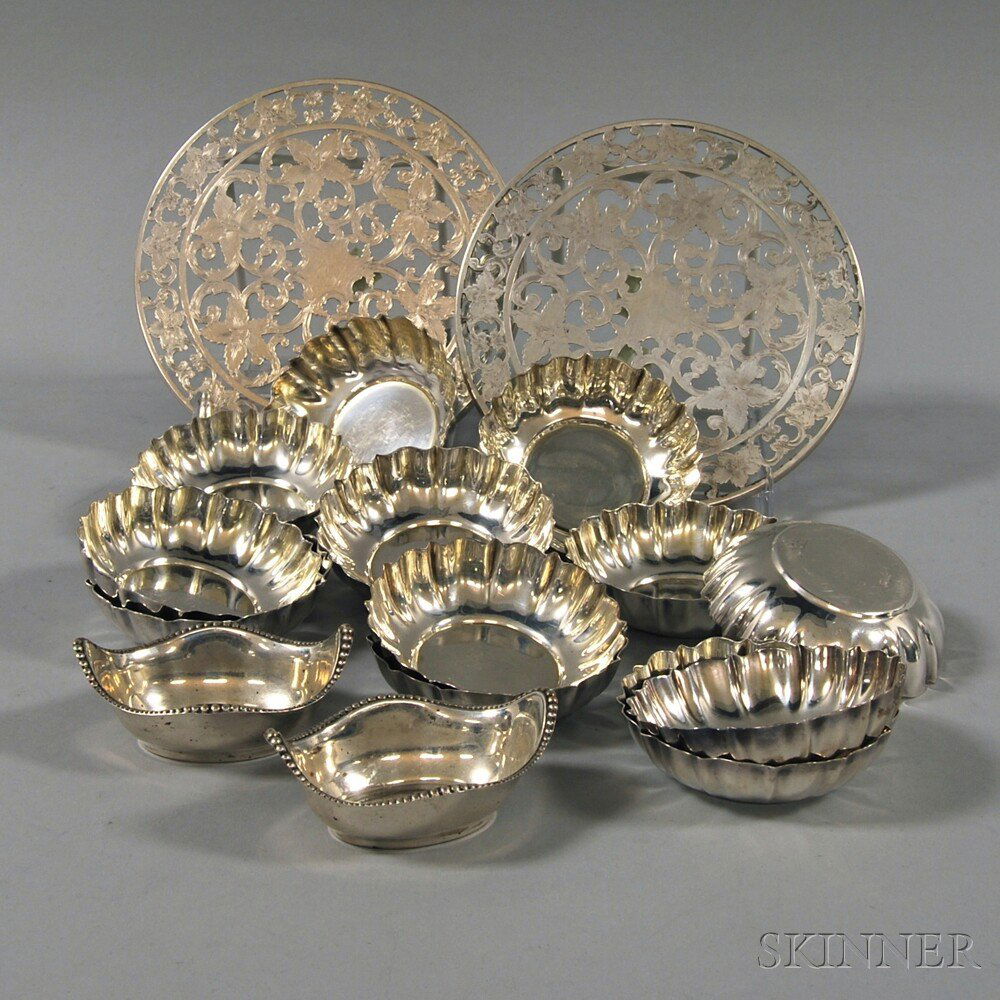 Group of Assorted Small Sterling Silver Tableware, a se: Group of Assorted Small Sterling Silver Tableware, a set of twelve Cartier nut dishes, a pair of Gorham open salts, and a pair of Webster silver overlay glass trivets, approx. 16.1 troy oz. weighable