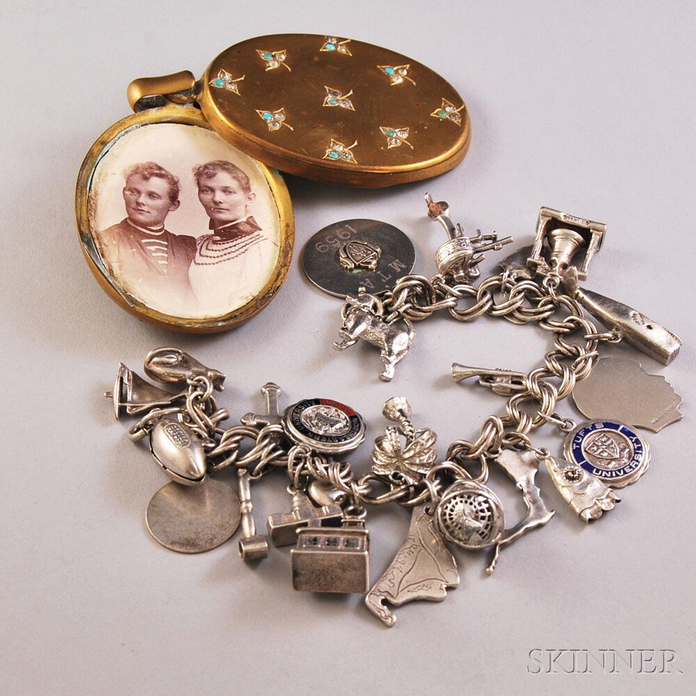 Two Jewelry Items, a Victorian stone-inlaid gold-tone l: Two Jewelry Items, a Victorian stone-inlaid gold-tone locket pendant, lg. overall 2 7/8, and a sterling silver charm bracelet with an assortment of mostly sterling silver charms, many New England-them