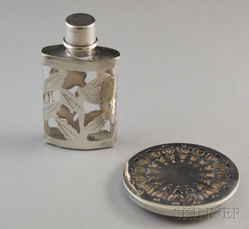 Two Mexican and Tiffany & Co. Sterling Silver Items, a: Two Mexican and Tiffany & Co. Sterling Silver Items, a Tiffany & Co. circular perfume vinaigrette pendant with pierced geometric floral decoration to front and back, dia. 2, and a Mexican glass perfum