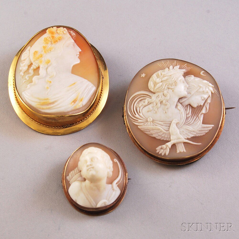 Four Antique Brooches, three shell-carved cameos and a: Four Antique Brooches, three shell-carved cameos and a floral-decorated painted porcelain pin.