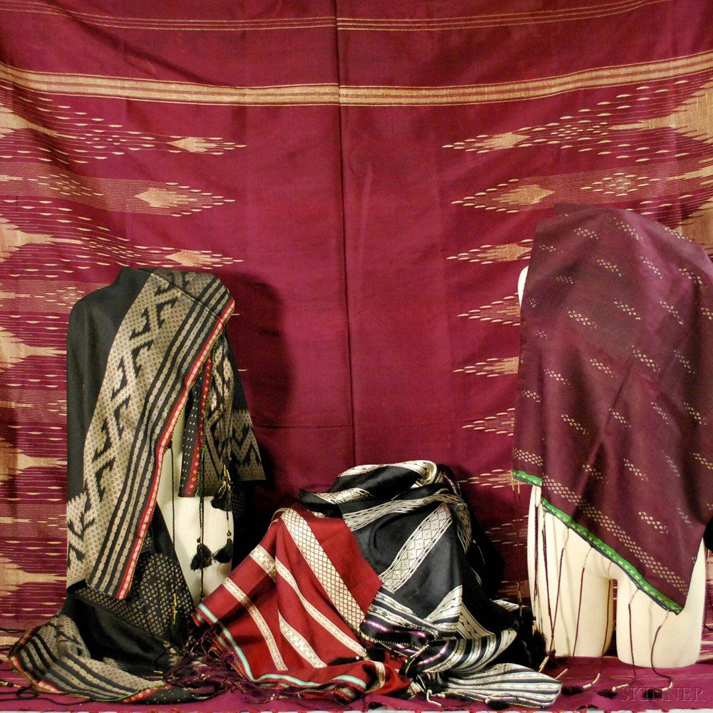 Five Middle Eastern Silk Textiles, 19th/20th century, i: Five Middle Eastern Silk Textiles, 19th/20th century, in shades of predominantly maroon or black, all with patterns and twisted or braided fringe, four headcloths/Keffiyehs and a large wrap. Provenanc