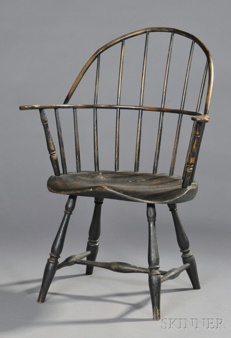 Black-painted Windsor Sack-back Chair, New England, lat: Black-painted Windsor Sack-back Chair, New England, late 18th century, with shaped saddle seat, old surface, (imperfections and repair), ht. 36 1/4, seat ht. 16 1/4 in.