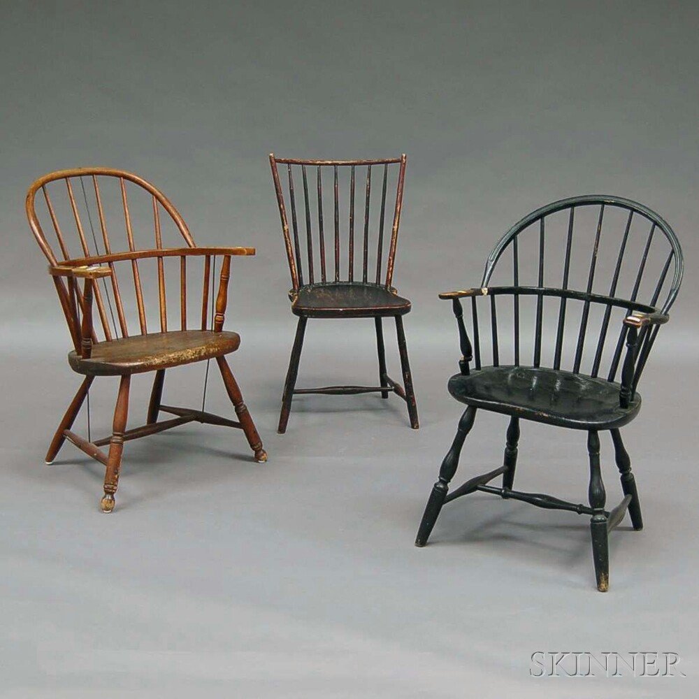 Three Windsor and Windsor-style Chairs, a black-painted: Three Windsor and Windsor-style Chairs, a black-painted sack-back armchair and rod-back side chair, and a Windsor-style wood sack-back armchair.