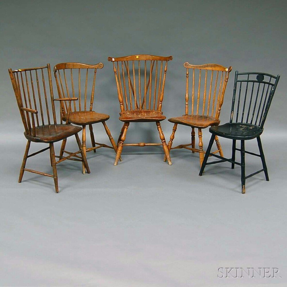 Five Assorted Windsor Chairs, a black-painted birdcage: Five Assorted Windsor Chairs, a black-painted birdcage side chair, two carved fan-back side chairs, a rod-back armchair, and a braced carved fan-back side chair.