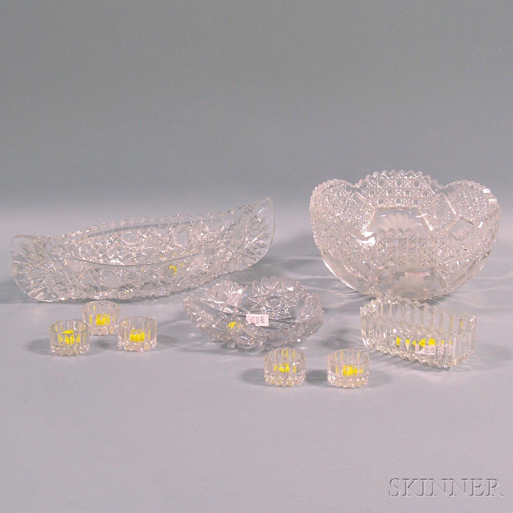 Eight Colorless Cut Glass Table Items and a Pressed Sug: Eight Colorless Cut Glass Table Items and a Pressed Sugar Stand, including a bowl, canoe-shaped dish, a set of five salts and a small triangular dish.