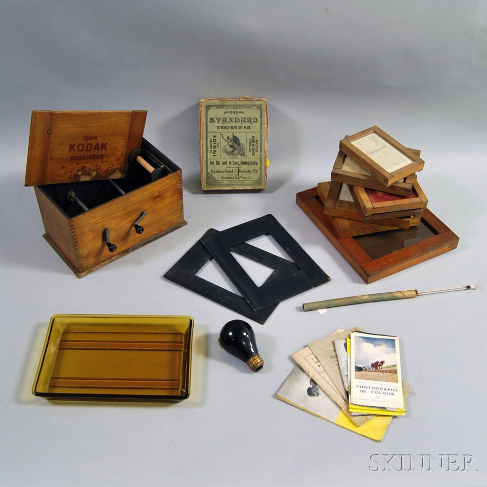 Group of Eastman Kodak Photographic Developing Equipmen: Group of Eastman Kodak Photographic Developing Equipment, late 19th/early 20th century, including boxed dry plates, pamphlets, amber glass tray, room lightbulb, thermometer, six plate frames, and a wo