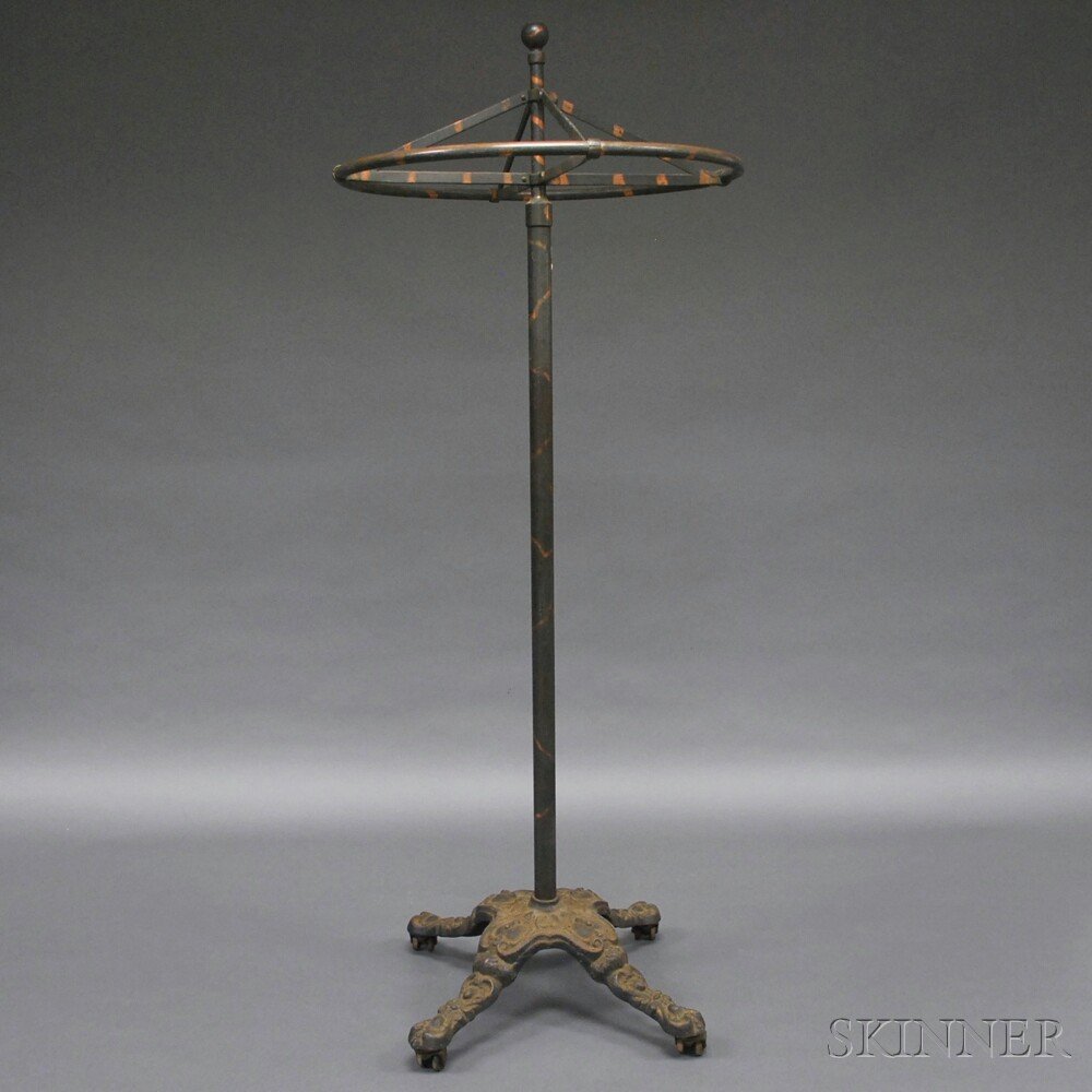 Large Victorian Metal Coat Rack, the cast metal umbrell: Large Victorian Metal Coat Rack, the cast metal umbrella-form rack with painted copper stripes, ball-form finial, and cast iron base with casters, ht. 76 in.