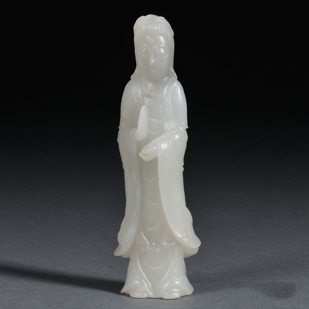 Hardstone Guanyin, China, 20th century, standing with a: Hardstone Guanyin, China, 20th century, standing with a ruyi scepter in her left hand, with a wisp of white inclusion, ht. 5 1/2 in.