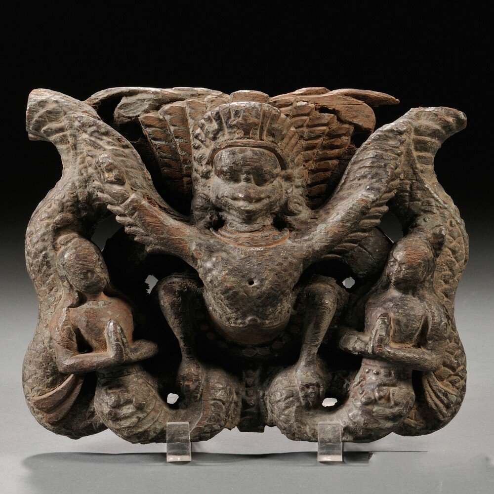 Wood Carving of Garuda, Nepal, 17th/18th century,: Wood Carving of Garuda, Nepal, 17th/18th century, rectangular, depicting Garuda perched with wings spread on a pair of nagas, 8 x 9 1/2 in.