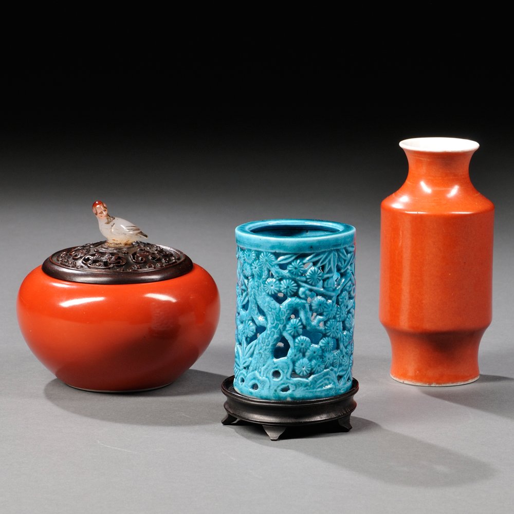 Three Monochrome Items, China, a miniature rouleau vase: Three Monochrome Items, China, a miniature rouleau vase on with an elongated foot, decorated with a coral red glaze, an incense holder, the cylindrical body decorated with a turquoise glaze and openwo
