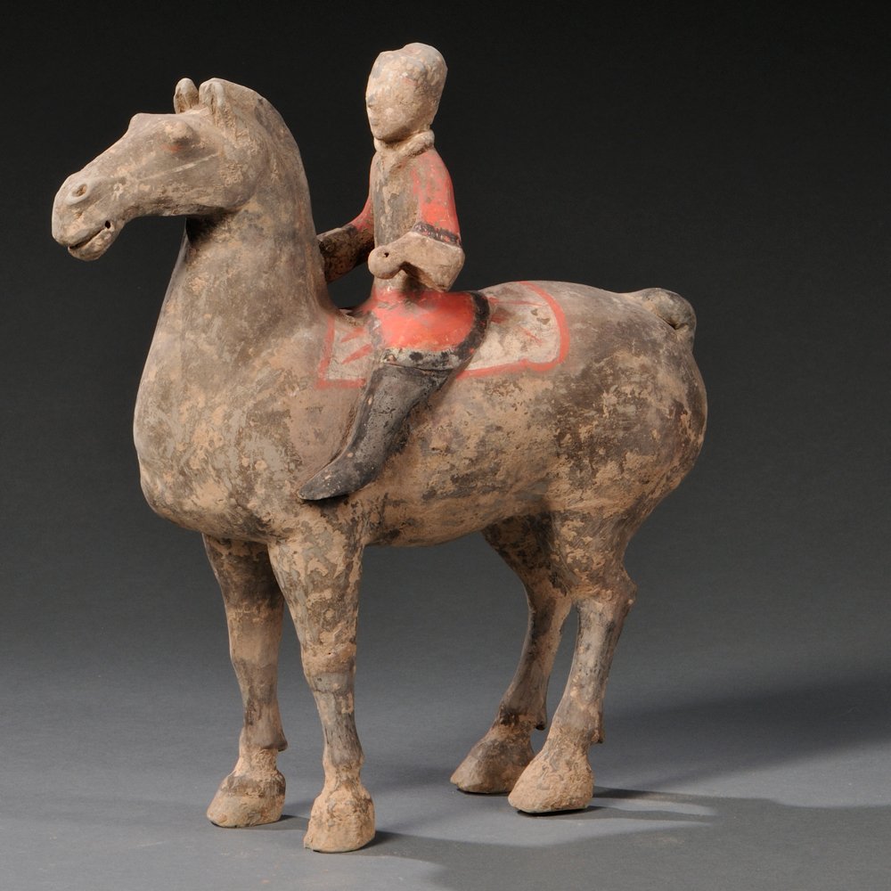 Pottery Horse and Rider, China, Han Dynasty style, the: Pottery Horse and Rider, China, Han Dynasty style, the finely modeled and painted earthenware horse and rider retain much of its black and red original pigment, ht. 11 7/8 in. Note: No technical exami