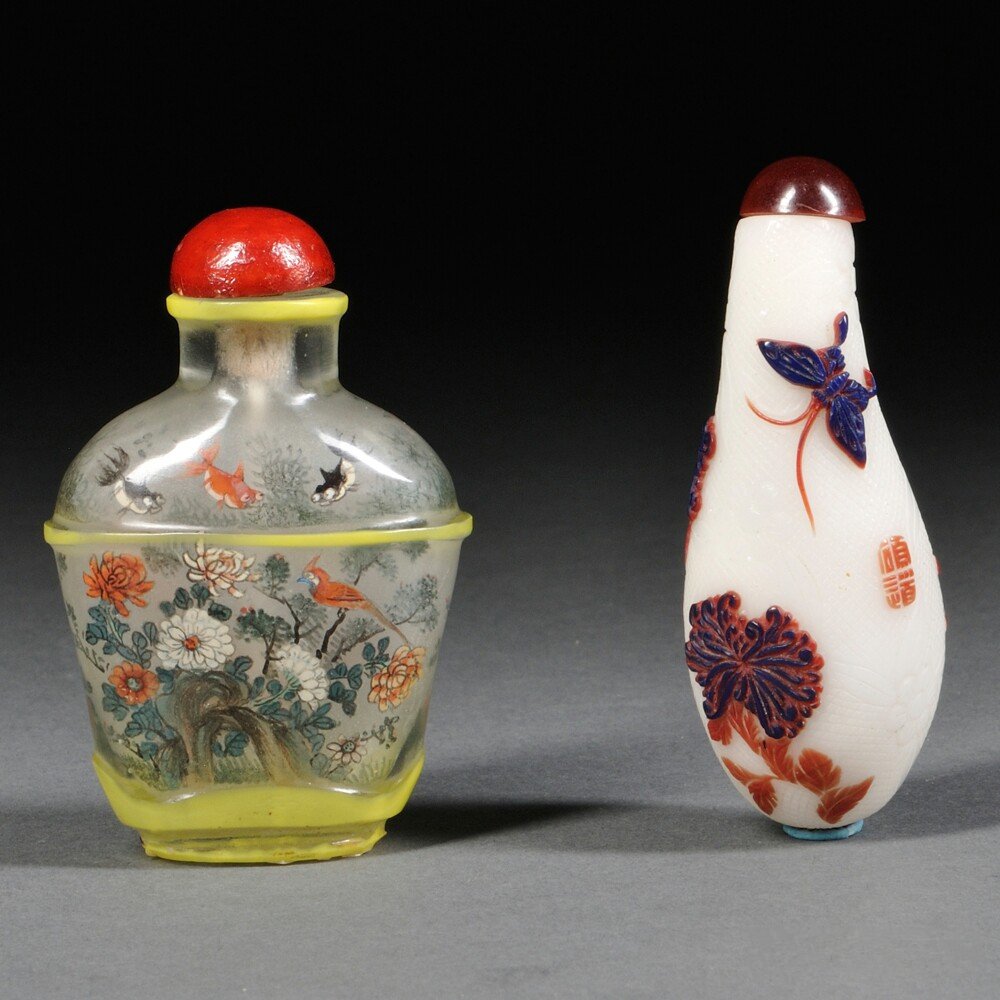 Two Peking Glass Snuff Bottles, China, 19th/20th: Two Peking Glass Snuff Bottles, China, 19th/20th century, a gourd-shaped bottle, decorated with carved flowers and butterflies in brown and blue on a white ground with incised decorations, inscribed "