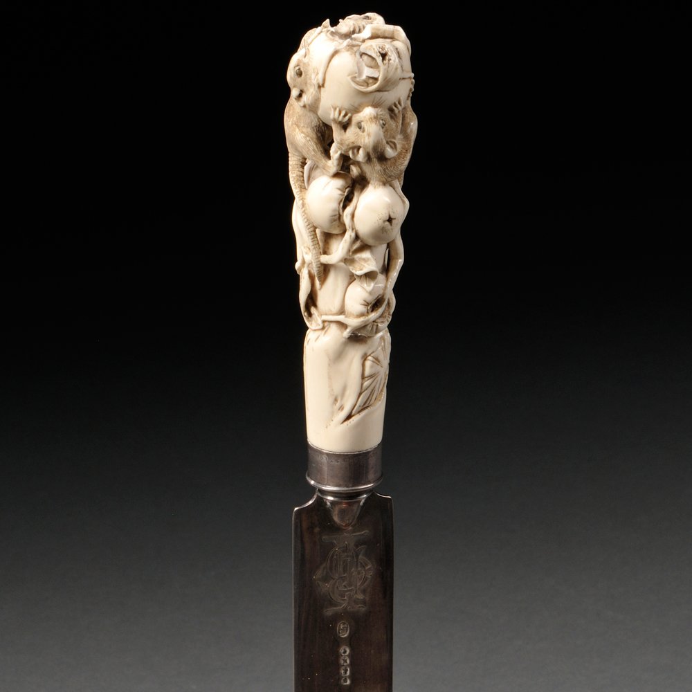 Carved Ivory Handle on Silver Paper Knife, Japan,: Carved Ivory Handle on Silver Paper Knife, Japan, 19th/20th century, with carved mice gnawing on persimmons, with incised details and inlaid eyes, attached to a silver paper knife, hallmarked for Walt
