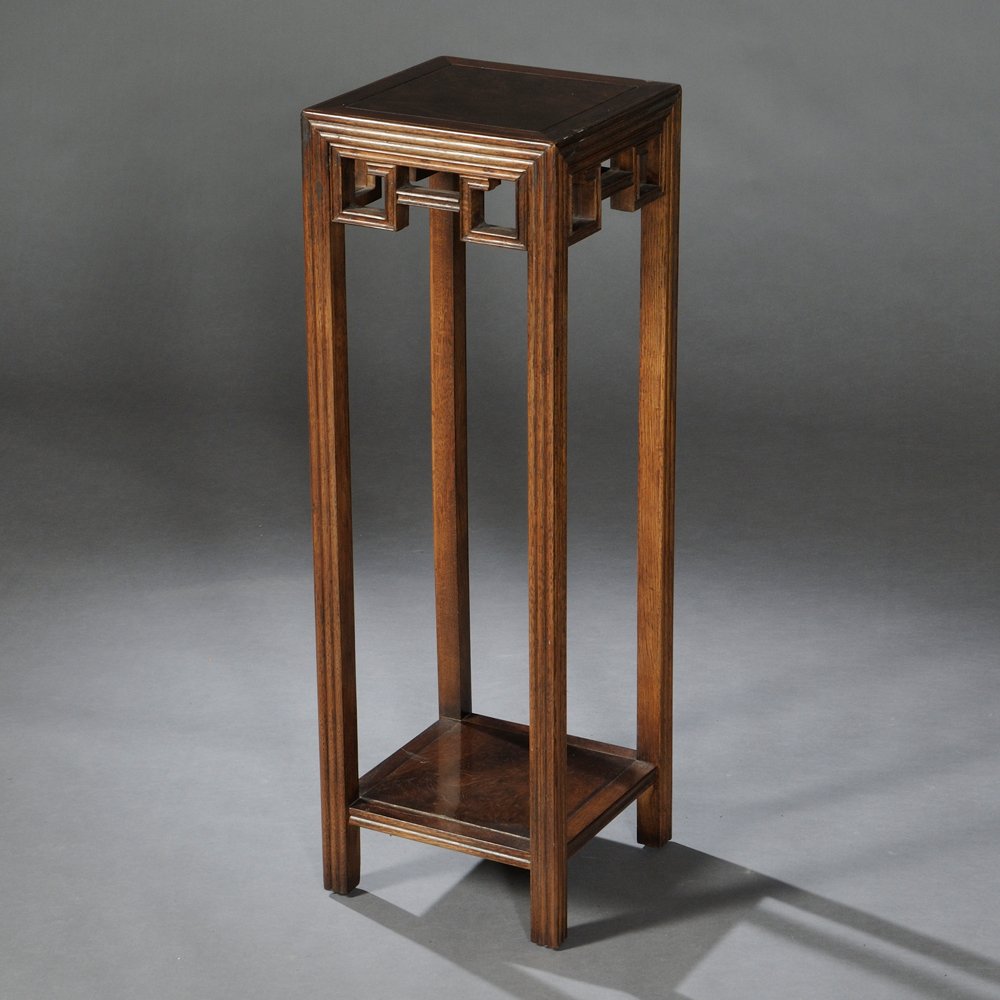 Baker Tall Stand, in the Chinese style, hardwood,: Baker Tall Stand, in the Chinese style, hardwood, burlwood top set in reeded frame, geometric meander openwork apron, lower shelf also burlwood, "Baker Furniture" label, 10 1/2 x 10 1/2, ht. 32 in.