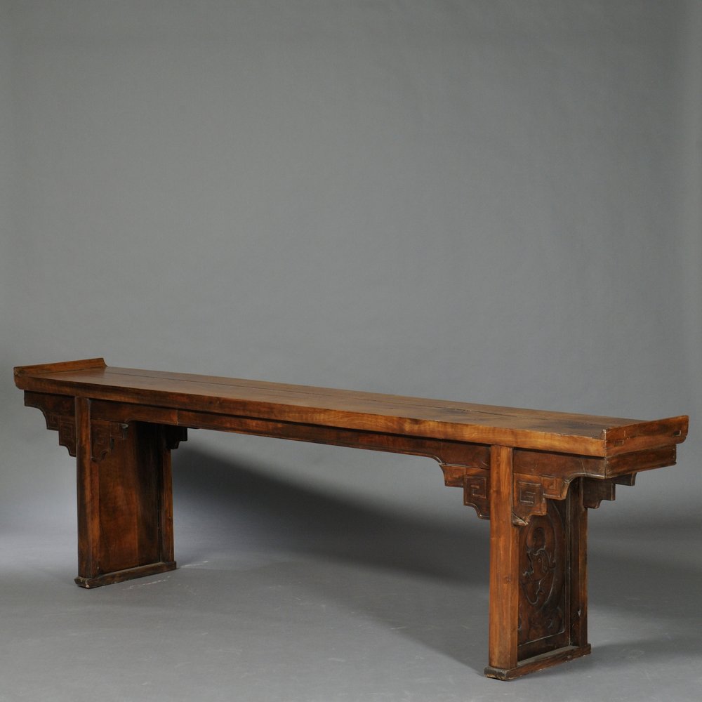 Recessed Leg Table, China, top constructed to resemble: Recessed Leg Table, China, top constructed to resemble a single jumu plank, everted flanges at ends, beaded apron and spandrels, rounded legs and shoe foot frame panels carved with dragons, lg. 117 1/
