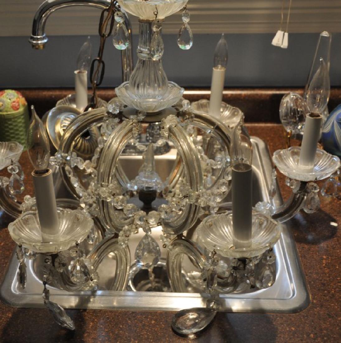 Lighting: Crystal chandelier with hanging crystals, 6 arms 20" h. x 21" d.