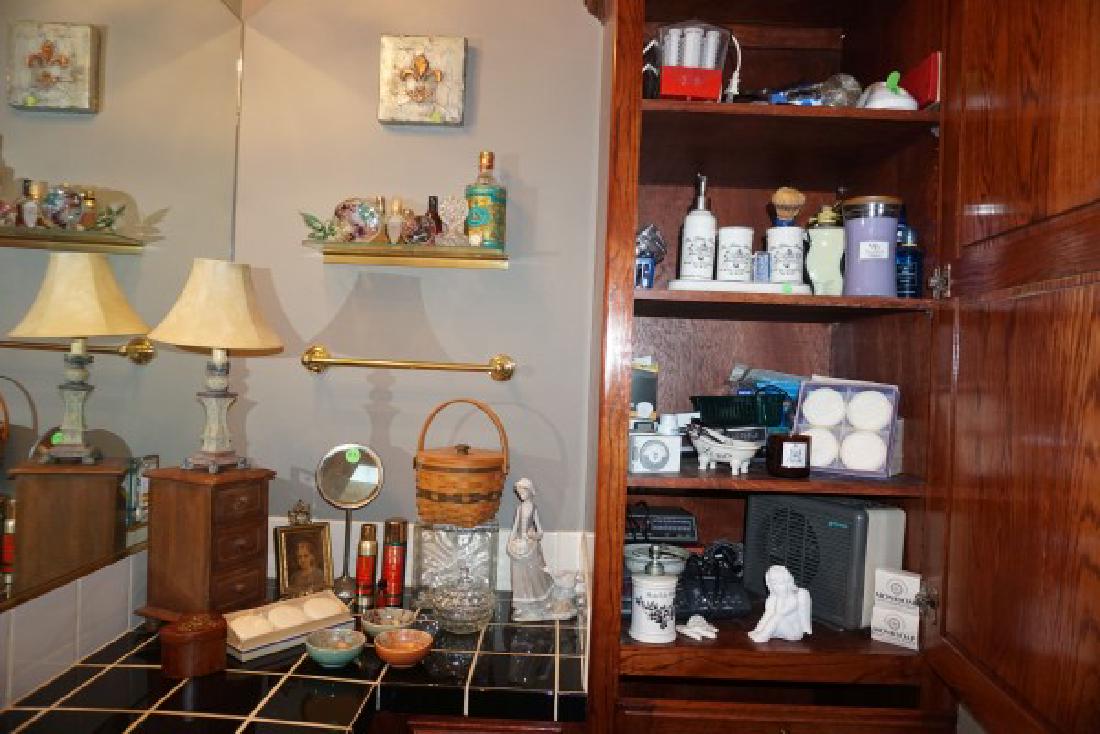 Collectibles: 9 perfume bottles, some are crystal, glass butterfly, fleur-de-lis painting,Decorative boxes, chest, beveled mirror, toiletries bath items, decorative soaps, small electronics
