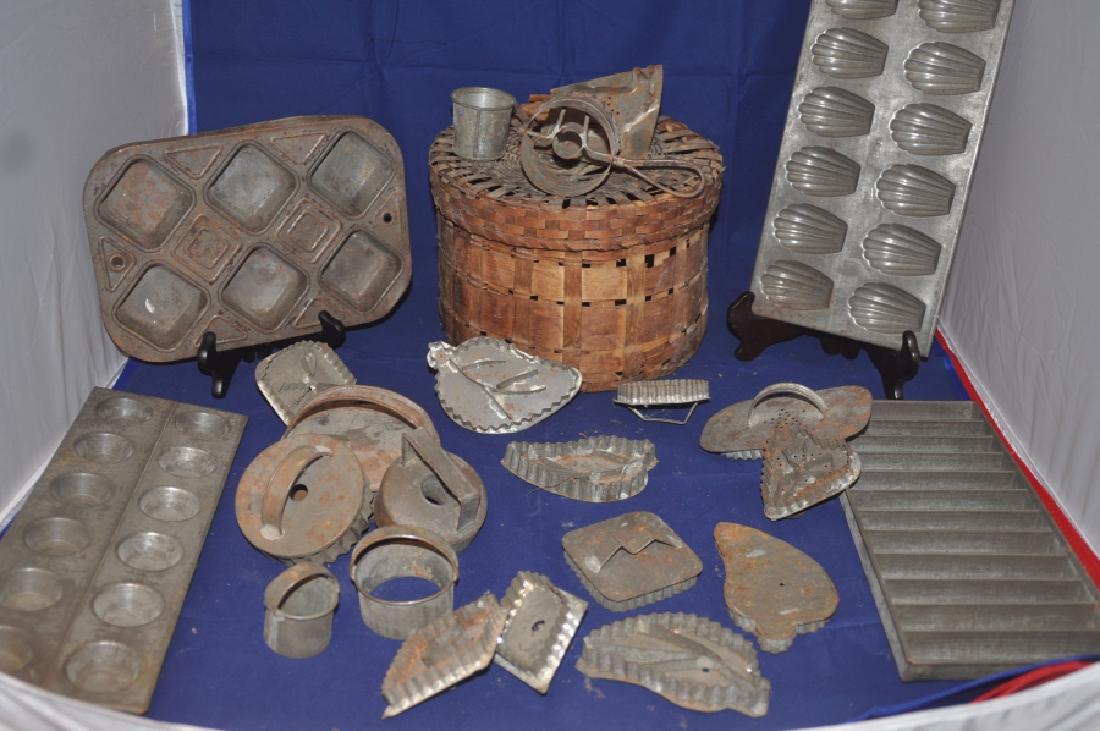 Baskets: Antique basket with 5 biscuit cutters, 12 cookie cutters, doughnut cutter, cup cake mold & cookie molds, 19th century