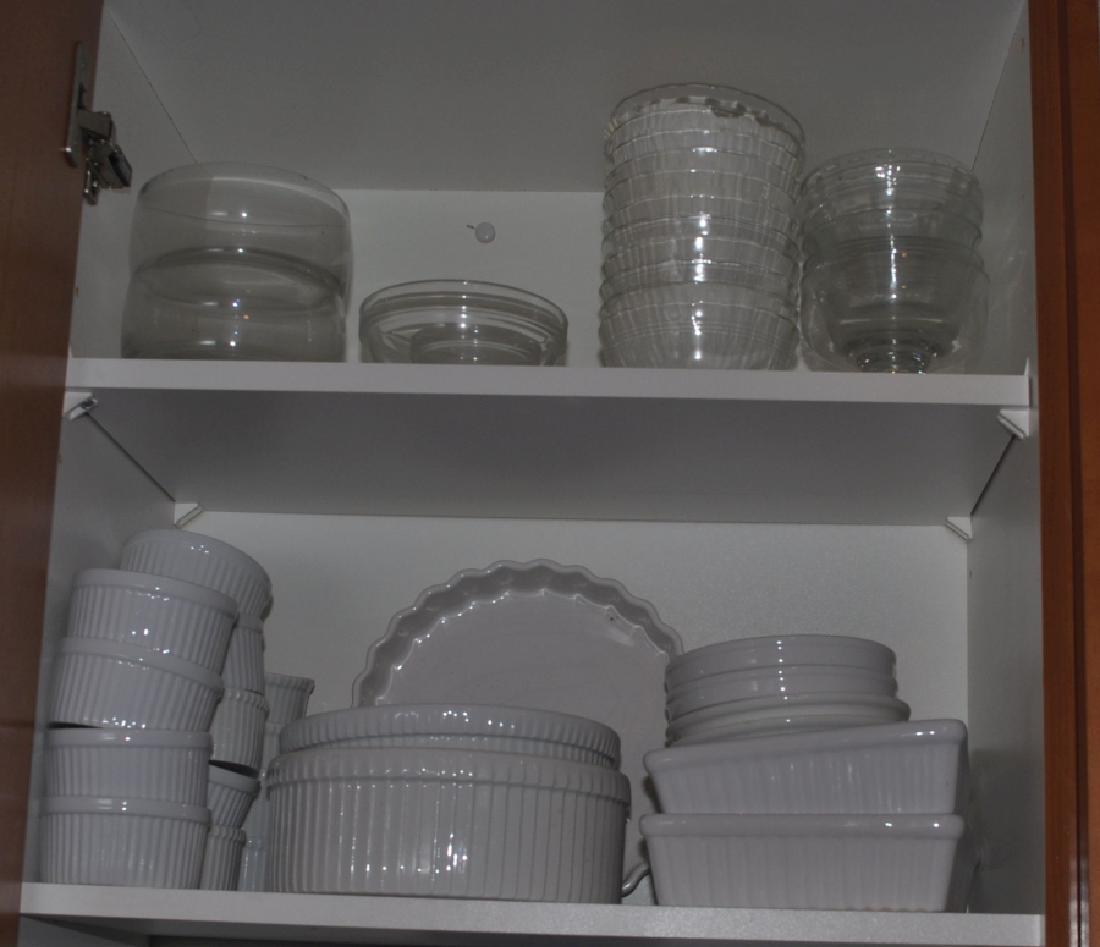 Kitchen: 4 shelves of kitchen ware, plates, bowls, plates by Dansk, mugs, bake ware, Baxter, Crate & Barrel, some from France