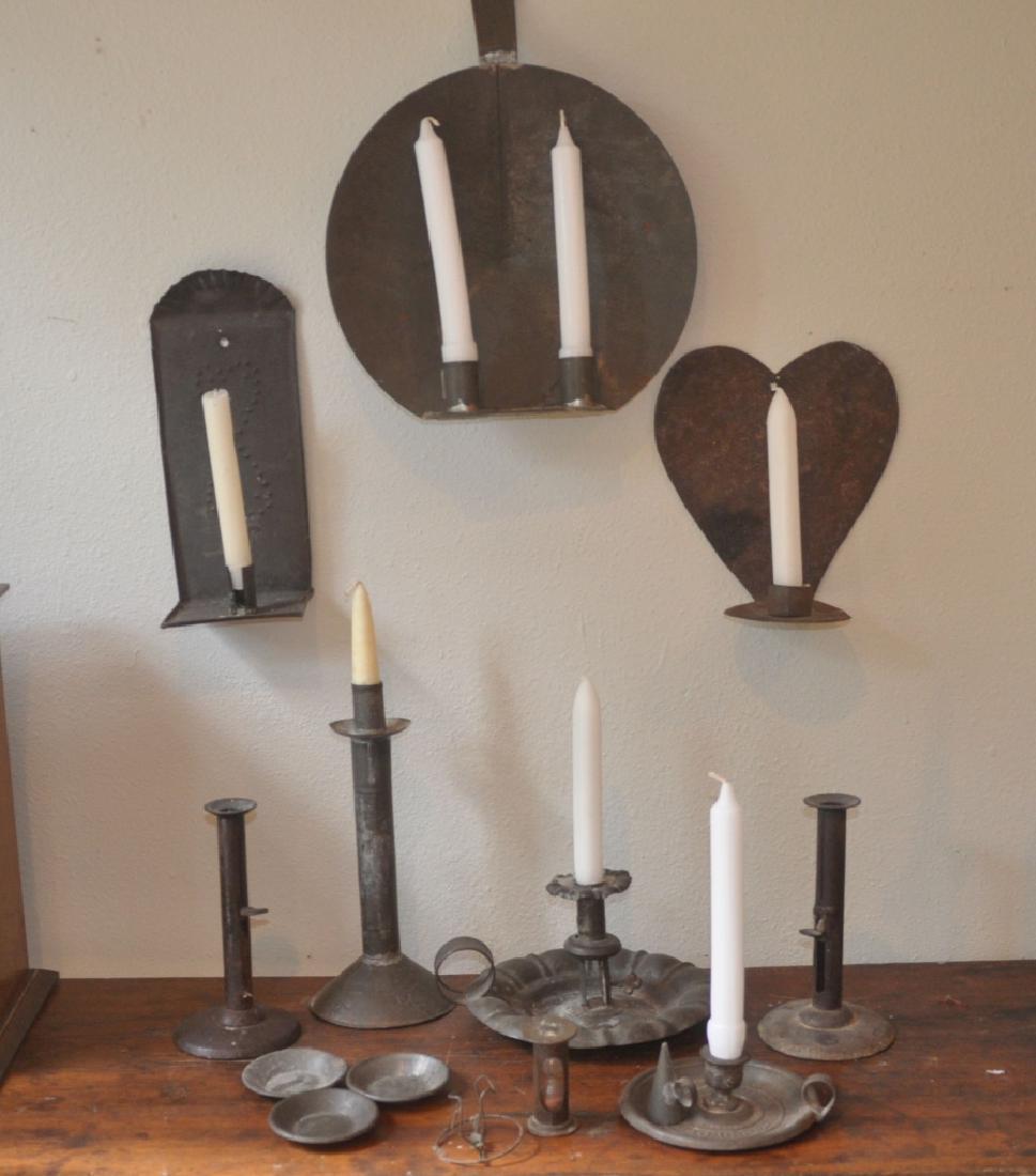Primitive Collectibles: Assortment of tin: 2 chamber sticks, 3 candle sticks, 3 wall sconces, candle snuffer, hour glass, 3 small plates, 19th century