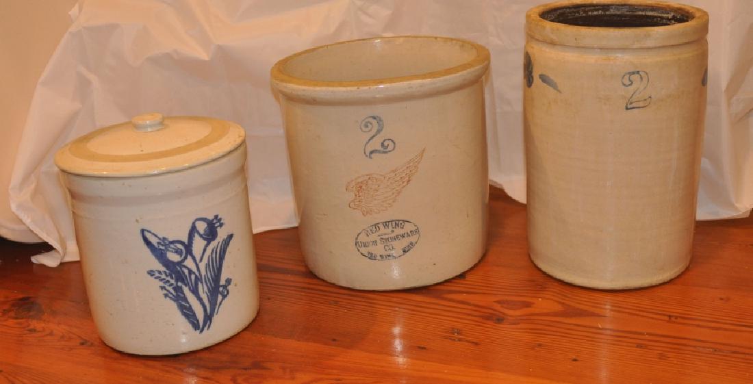 Crocks: 3 old crocks: cover crock 7 1/2" h, crock by Redwing Union Stoneware Co. 9 1/2" h, # 2 crock with blue flowers 11" h, 19th century