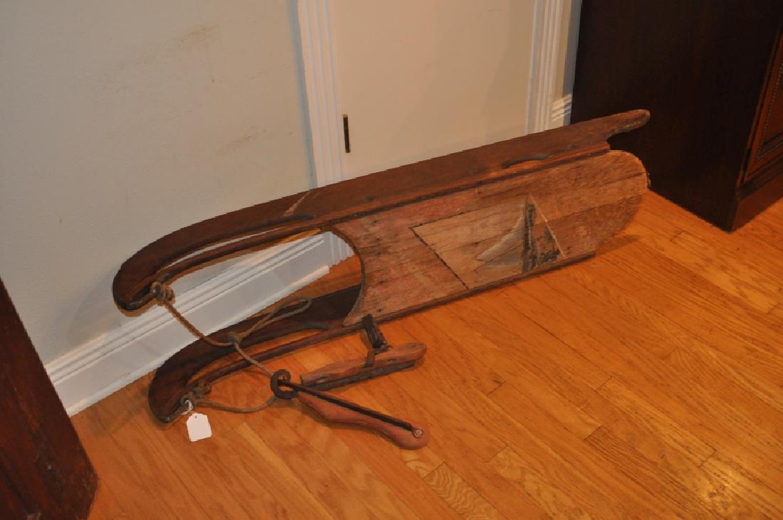 Wood Sled & Ice Skates: Old wood sled with metal glides, wood & metal ice skates, sled 4'2" w x 1' d x 9 1/2" h, 19th century