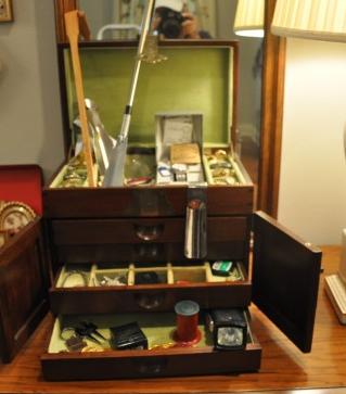 Men's jewelry box with contents: Men's jewelry box with contents: Cuff Links with stones, gold & silver tones, tie tacks, old keys, wind up flash light, watches, vintage cigarette lighter, money clips, 4 shoe horns, 1 with golf handl
