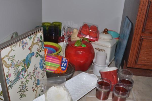 Kitchenware: Kitchenware: 3 cookie jars-apple, cat, biscotti, trivets, plastic glasses, mixing bowls-serve, mix & stir set, set of Zak mixing bowls, 2 stoneware canisters, Williamsburg place mats, Neuwrith bread d