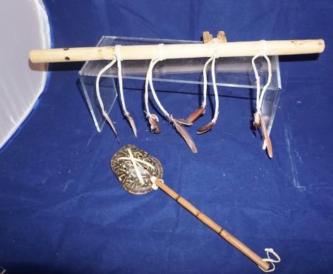 "Wind Whisper" flute by Charles Frazier 19" w,: "Wind Whisper" flute by Charles Frazier 19" w, ceremonial rattle with whole turtle shell 12" w, 20th century