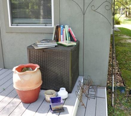Garden items:: Garden items: Garden books-several by Jill Peterson "Homestead" series, plastic outdoor chest, large terra cotta pot, small studio pottery pot, wind chimes, wind ornament, 21st century