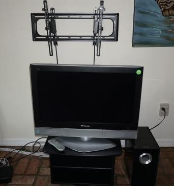 32" Panasonic flat screen TV with stand, Toshiba: 32" Panasonic flat screen TV with stand, Toshiba speaker, TV wall mount, TV flat screen wall mount