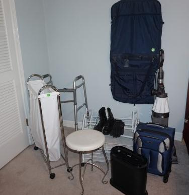 Assortment of household items:: Assortment of household items: Dyson vacuum, Homemedics air purflier, rolling under the bed racks, 2 shoe racks, walker, dirty clothes cart on wheels, stool, luggage