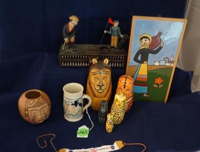 Interesting collectibles: iron golf bank, nesting dolls: Interesting collectibles: iron golf bank, nesting dolls (lg. doll is cracked), pottery tile, Indian face pottery vase, small German stein, hand beaded Indian bracelet, 2 small Indian blankets, 20th ce