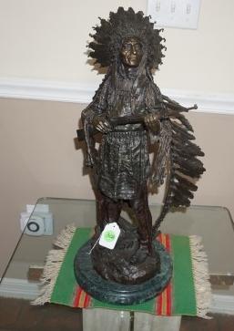 Beautiful bronze sculpture "War" by Karl Kauba,: Beautiful bronze sculpture "War" by Karl Kauba, (1865-1922), signed by the artist on base "Indian in Full Regalia" 75 feather headdress 12" x 27"' Besides the variety of color, Kauba's bronzes show a 