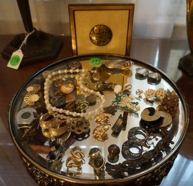 Mirrored silver plate tray, with jewelry and: Mirrored silver plate tray, with jewelry and interesting items: sterling earings, broach, clip earings, medals, LA Champions 1944 baseball, watch, 20th century