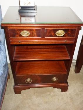 Pair of mahogany Chippendale end tables, drawer at top: Pair of mahogany Chippendale end tables, drawer at top and bottom with brass pulls, pull out shelf 22" w x 15" d x 31" h, 20th century