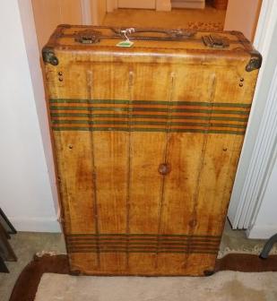 Antique travel trunk by Horn, leather straps, brass: Antique travel trunk by Horn, leather straps, brass accents 21" w x 9" d x 32" h,, 20th century