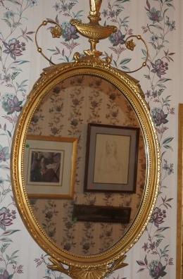 Oval gold gilt mirror, Federal style ornate crest 20" w: Oval gold gilt mirror, Federal style ornate crest 20" w x 37" h, 20th century